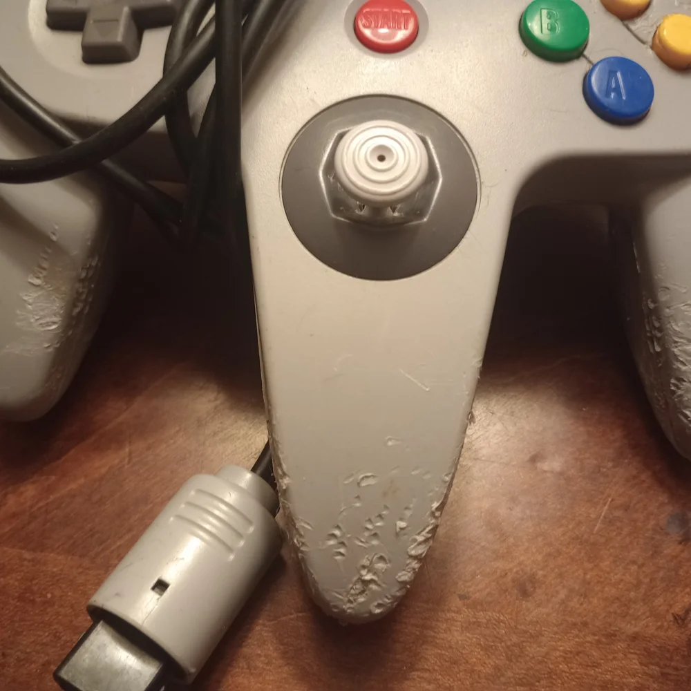 Gray and Pink Video Game Controllers